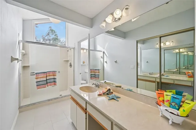 a bathroom with a sink a vanity and a mirror