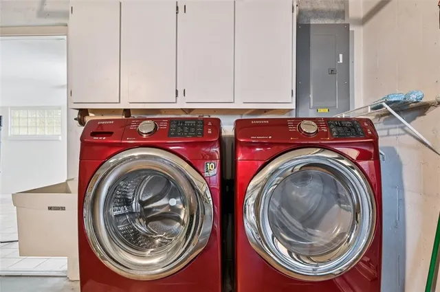 a utility room with dryer and washer