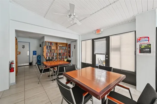 a view of a dining room with furniture and a table