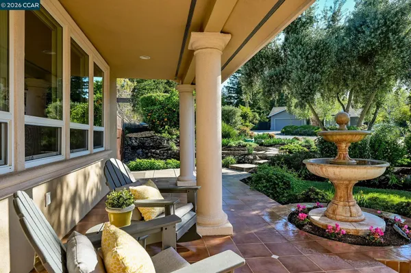 a front view of a house with sitting area