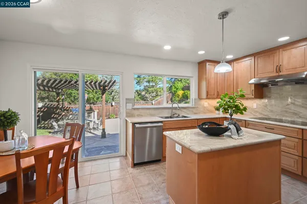 a view of a dining room with furniture and window