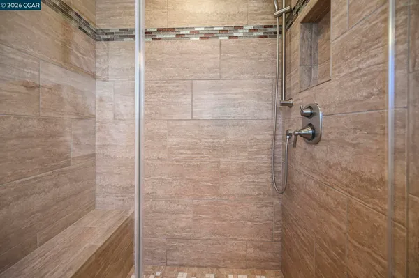 a view of a house with wooden fence