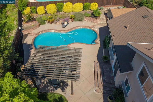 a aerial view of a house with a yard