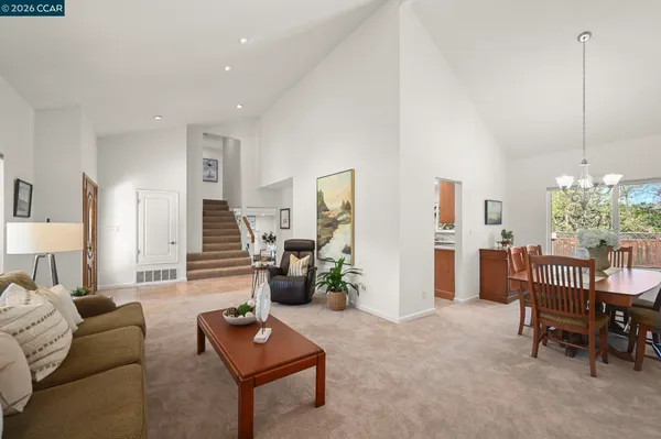 a living room with furniture and a table
