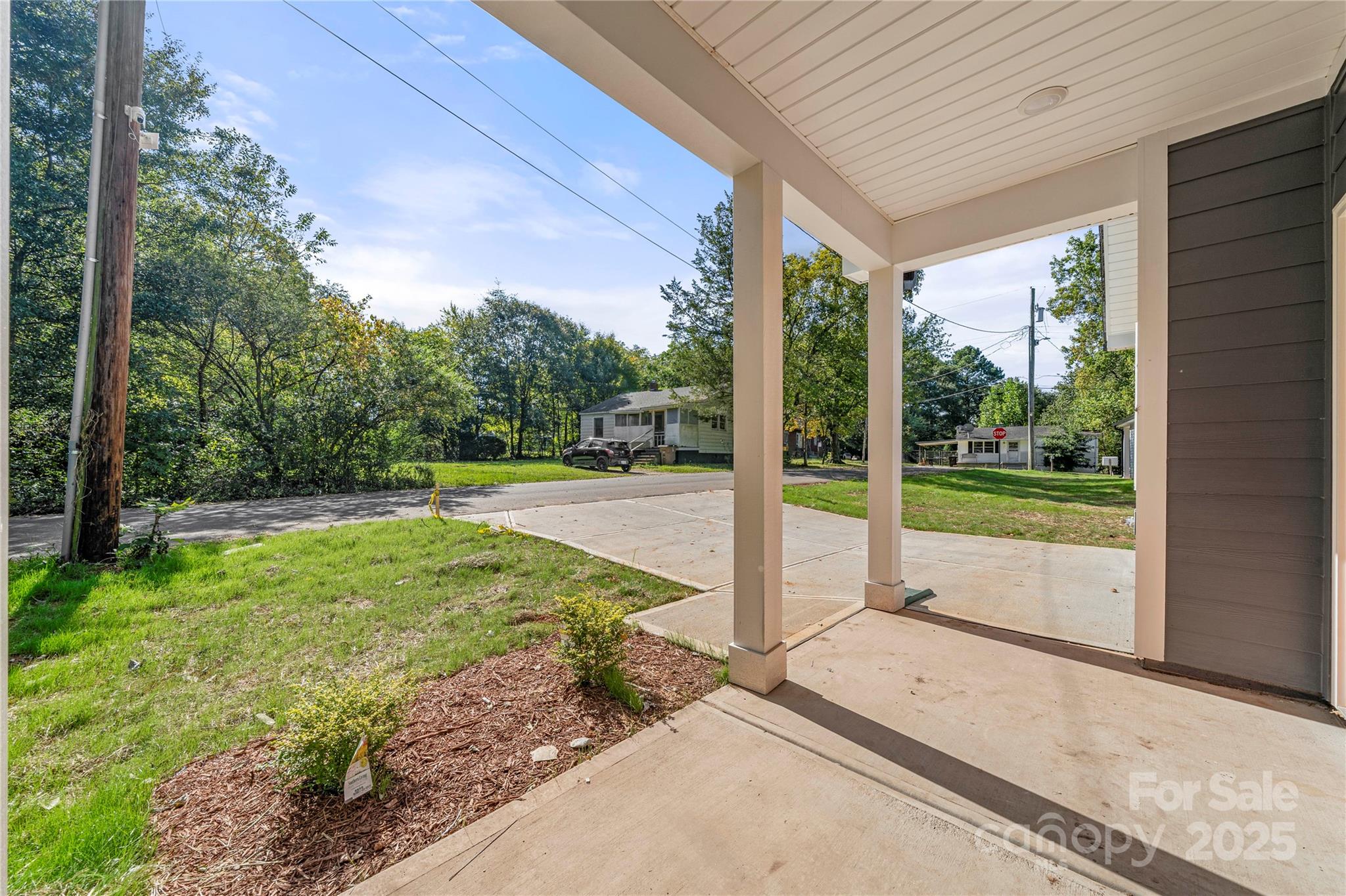 1104 Silver Street Shelby, NC 28152 - Photo 26 of 28 a view of backyard with large trees and plants