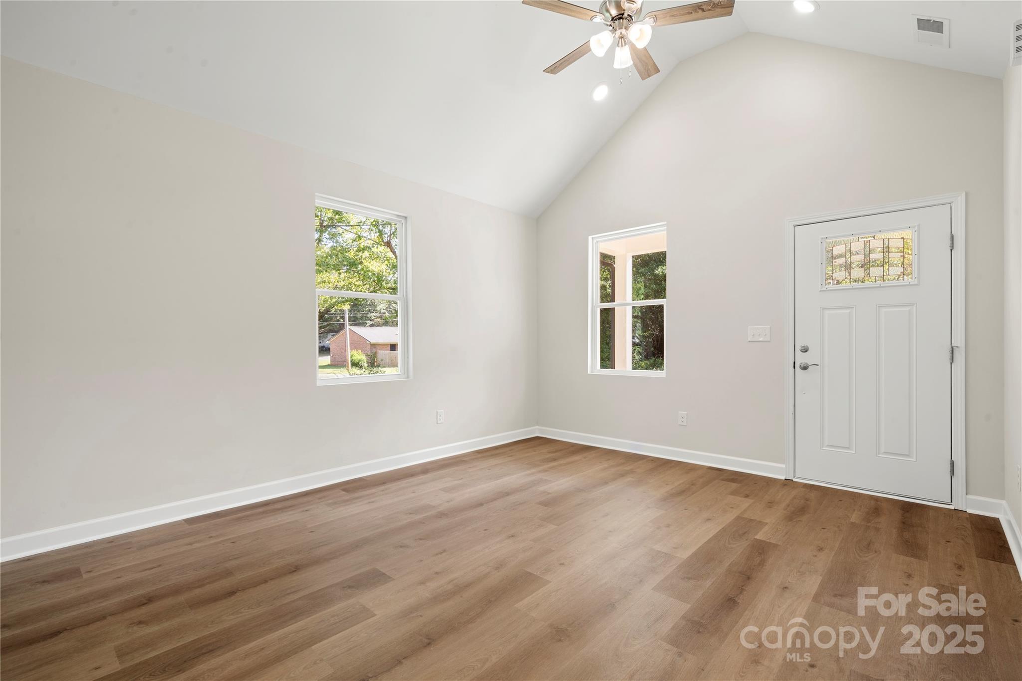 1104 Silver Street Shelby, NC 28152 - Photo 5 of 28 wooden floor in an empty room with a window