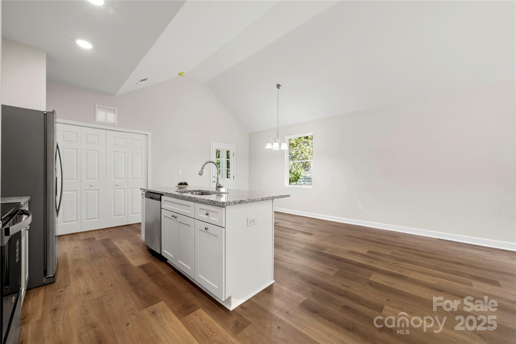 1104 Silver Street Shelby, NC 28152 - Photo 10 of 28 a kitchen with stainless steel appliances a stove top oven a sink and a refrigerator