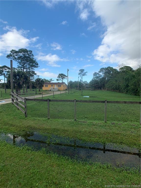6105 Southwest Gator Trail, Unit A Palm City, FL 34990 - Photo 3 of 19 a view of a grassy field