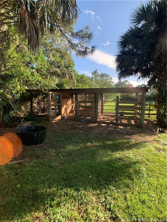 6105 Southwest Gator Trail, Unit A Palm City, FL 34990 - Photo 7 of 19 a swimming pool view with a lake view