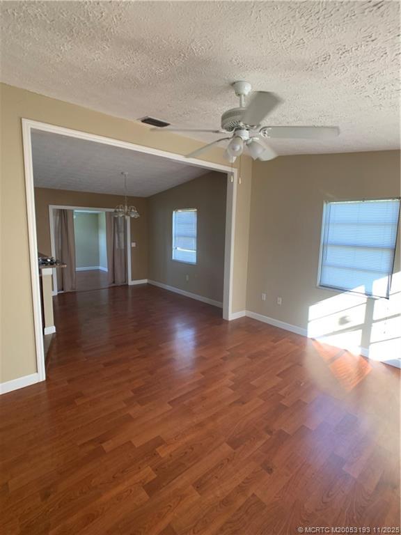 6105 Southwest Gator Trail, Unit A Palm City, FL 34990 - Photo 10 of 19 a view of a kitchen with a sink and a chandelier fan