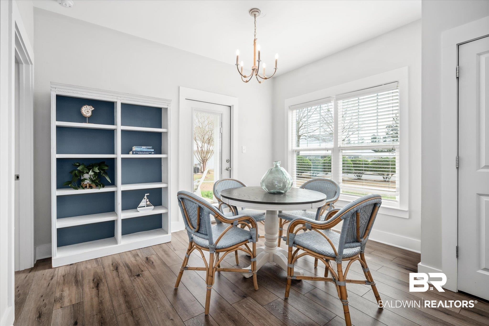 8056 Carmel Circle Foley, AL 36535 - Photo 9 of 28 Dining space with hardwood / wood-style floors and a notable chandelier