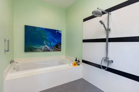 a bathroom with a bathtub and a shower