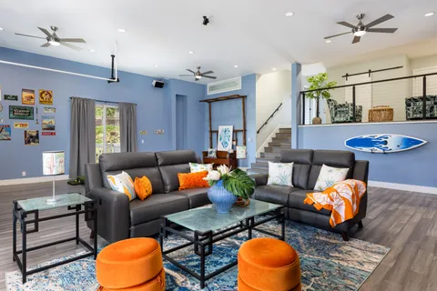 a living room with furniture and a window