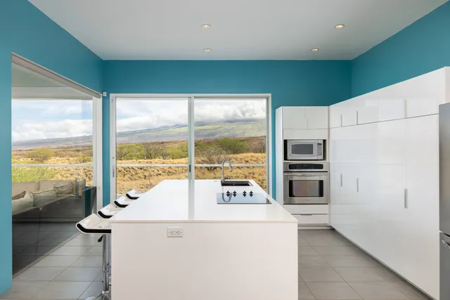 a kitchen with refrigerator and window