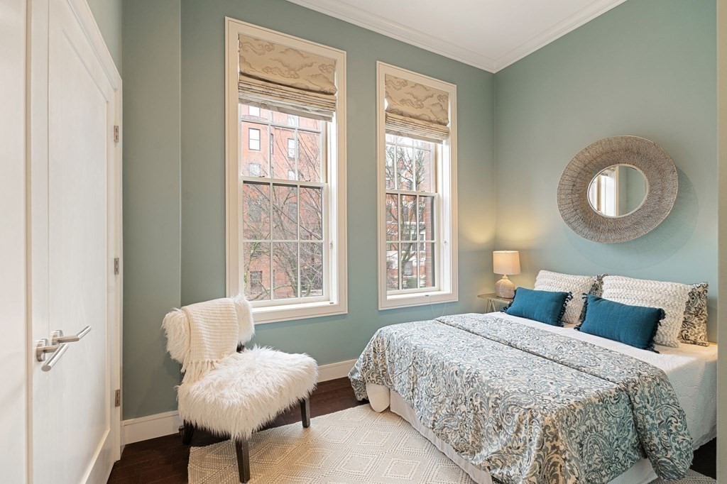 11 Exeter Street, Unit 5 Boston, MA 02116 - Photo 11 of 13 a bedroom with a bed and a window