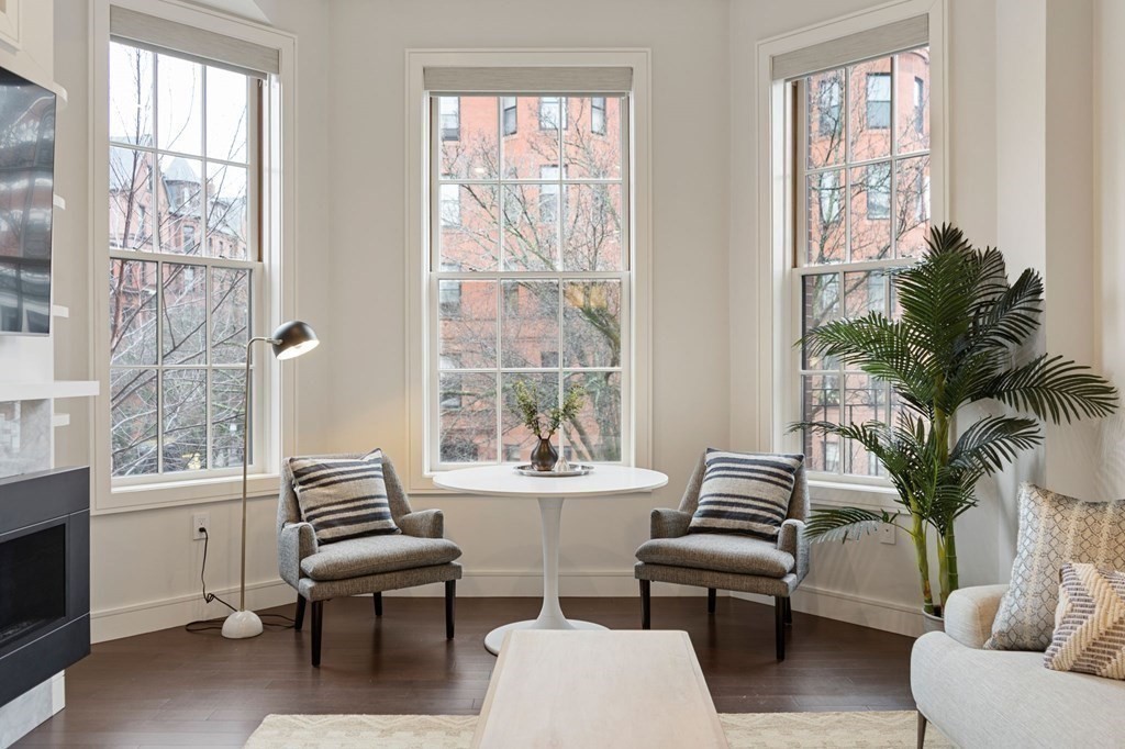 11 Exeter Street, Unit 5 Boston, MA 02116 - Photo 3 of 13 a living room with furniture and a large window