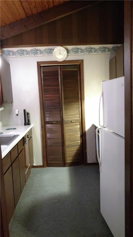 125 Birch Road Acme, PA 15610 - Photo 12 of 18 Kitchen just off the dining room. The laundry room is off the kitchen.