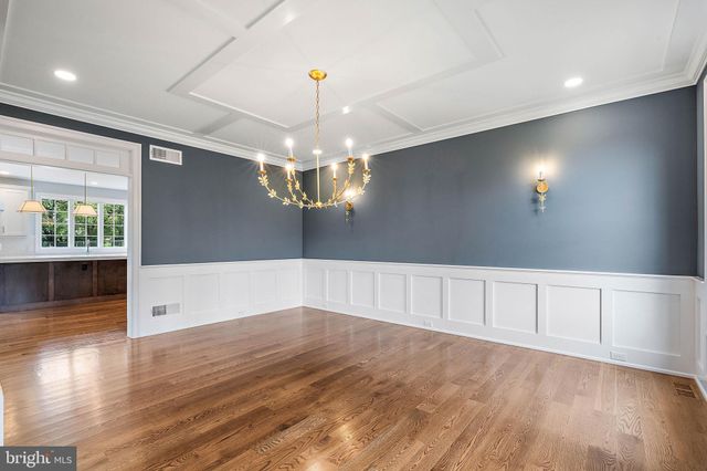a spacious bathroom with double sink and a mirror