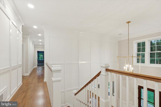 a bathroom with a sink a toilet a shower and a window