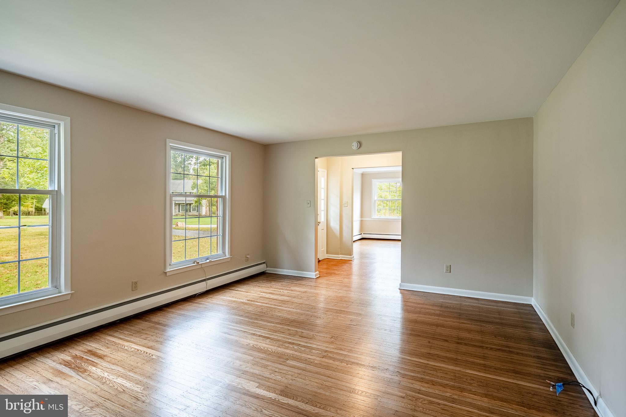 8 Andrews Road Malvern, PA 19355 - Photo 12 of 62 an empty room with wooden floor and windows