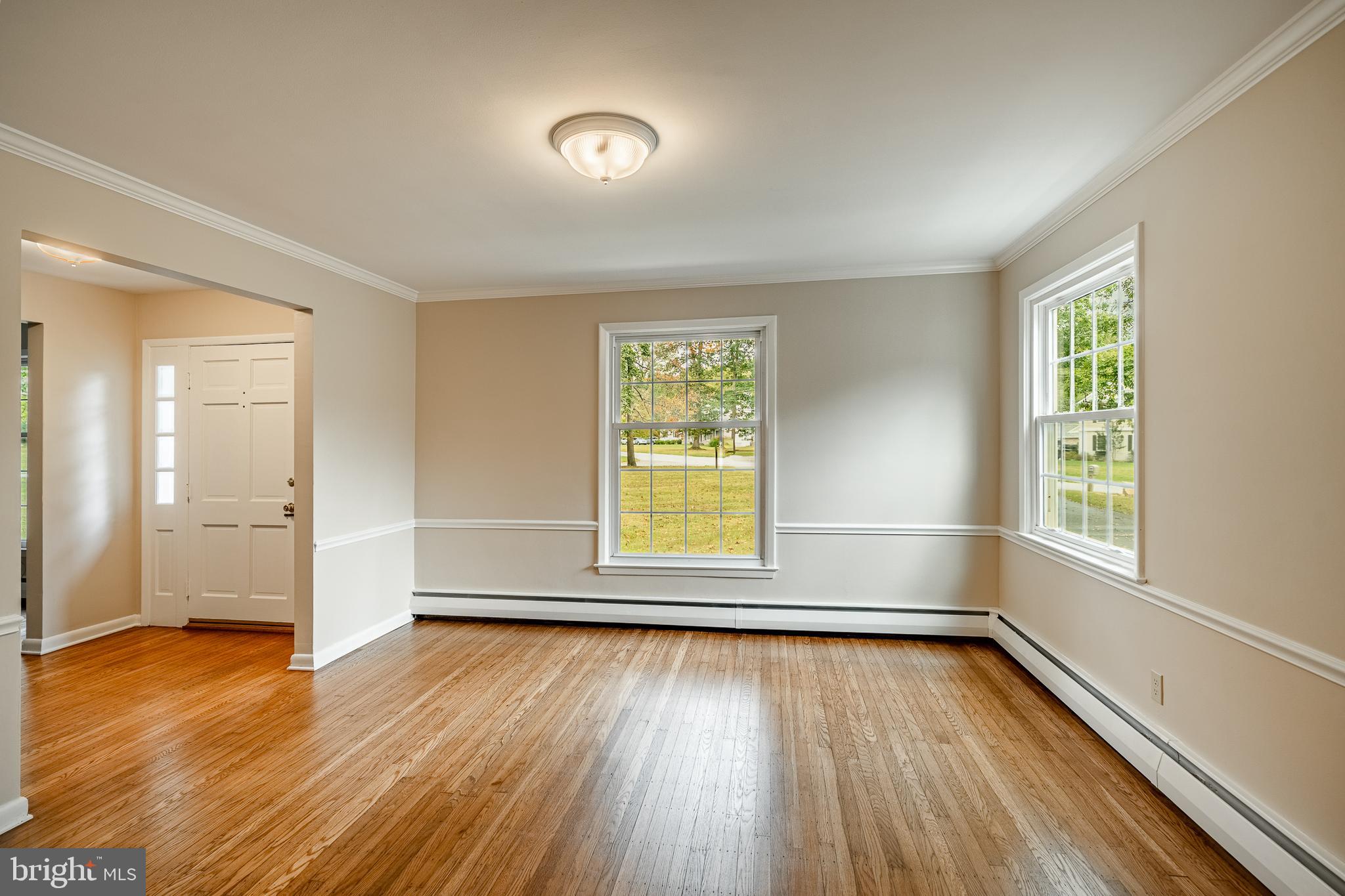 8 Andrews Road Malvern, PA 19355 - Photo 17 of 62 an empty room with wooden floor and windows
