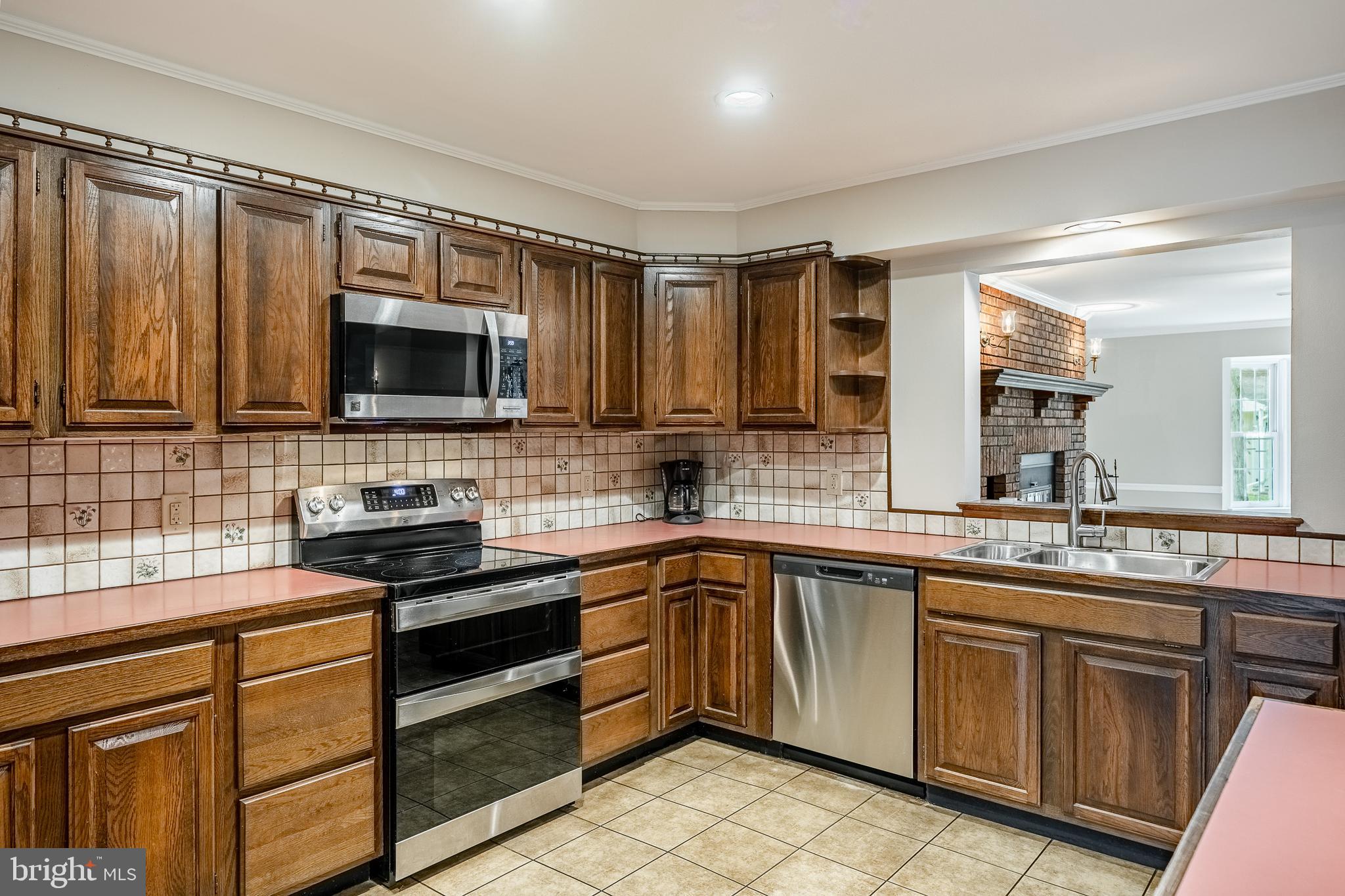 8 Andrews Road Malvern, PA 19355 - Photo 18 of 62 a kitchen with a sink stove and microwave