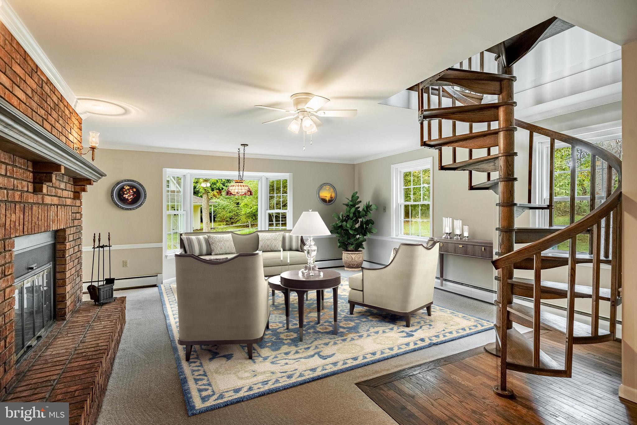 8 Andrews Road Malvern, PA 19355 - Photo 22 of 62 a living room with furniture a fireplace and a flat screen tv