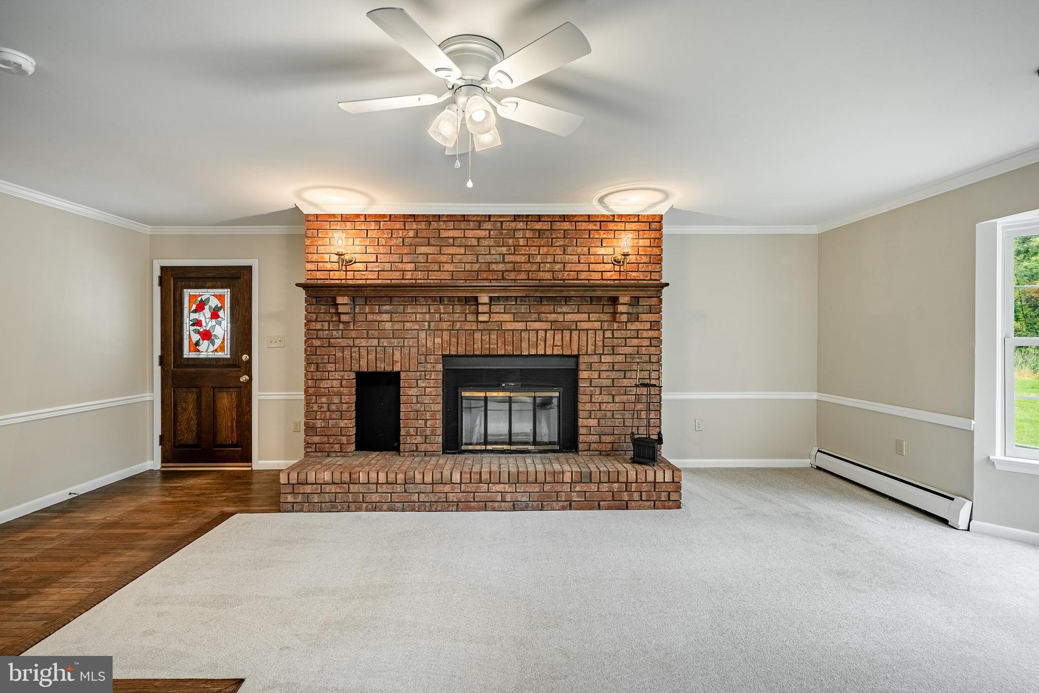 8 Andrews Road Malvern, PA 19355 - Photo 25 of 62 an empty room with windows and fireplace