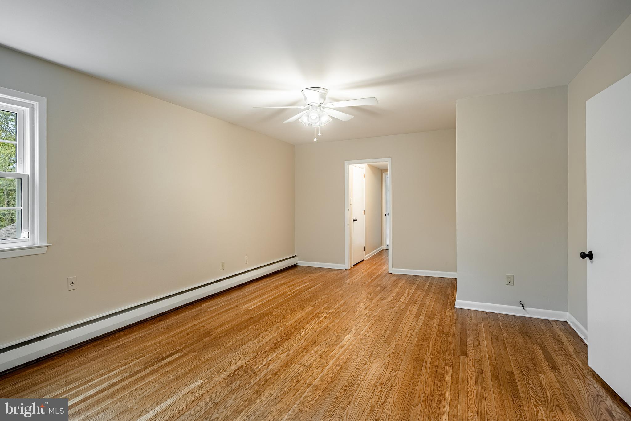 8 Andrews Road Malvern, PA 19355 - Photo 37 of 62 wooden floor in an empty room with a window