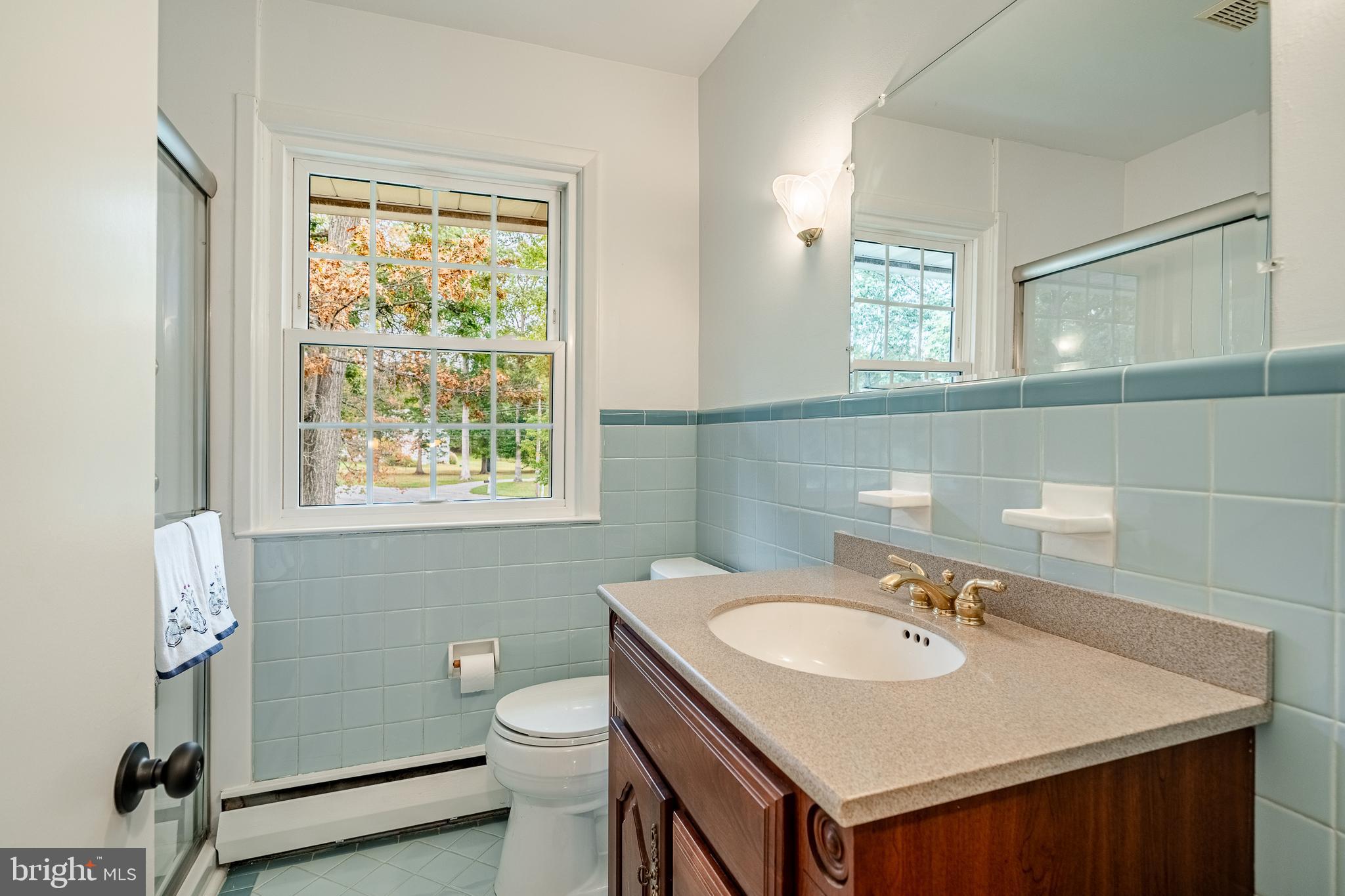 8 Andrews Road Malvern, PA 19355 - Photo 45 of 62 a bathroom with a sink toilet and a mirror