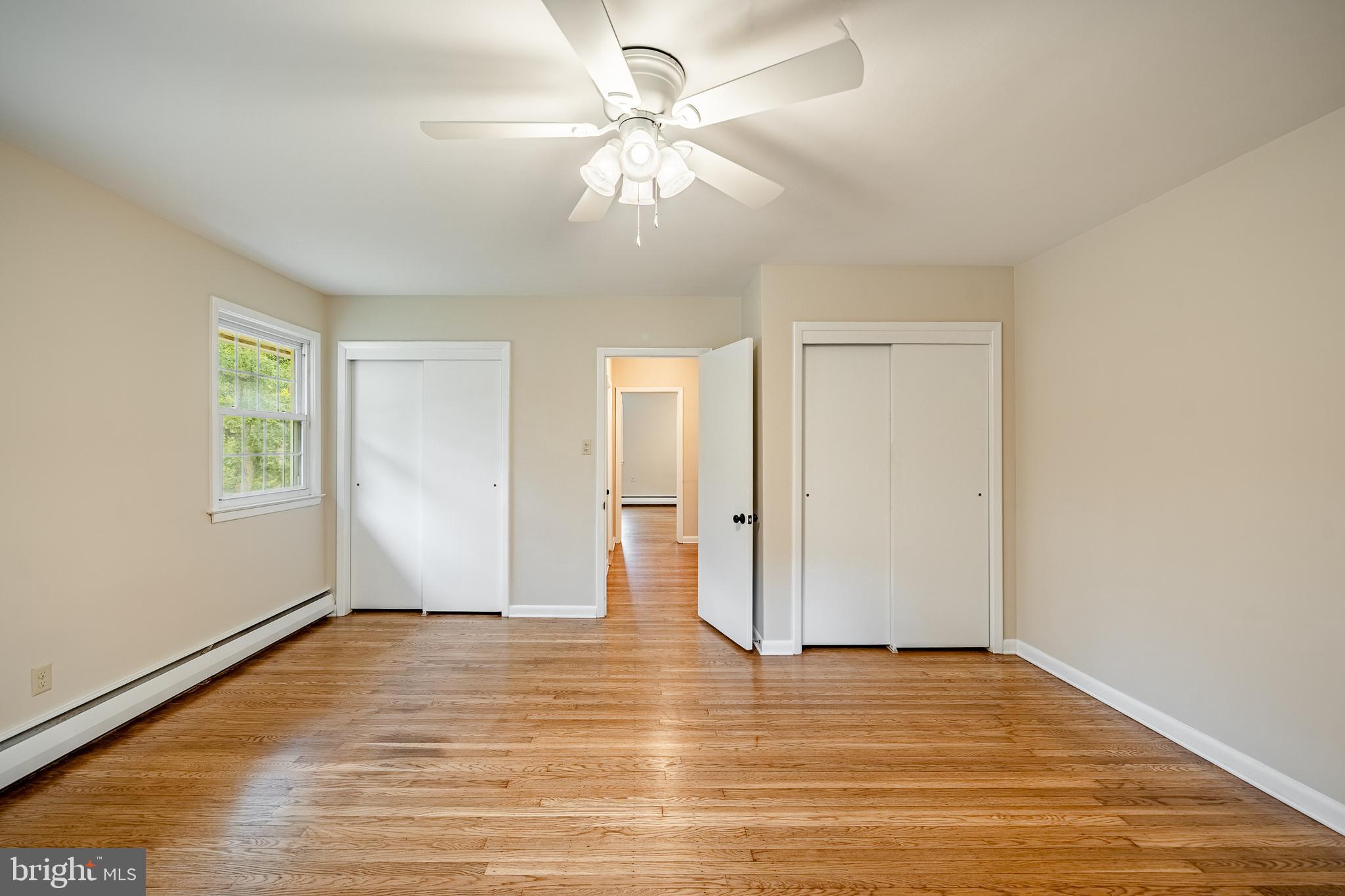 8 Andrews Road Malvern, PA 19355 - Photo 48 of 62 an empty room with wooden floor and windows
