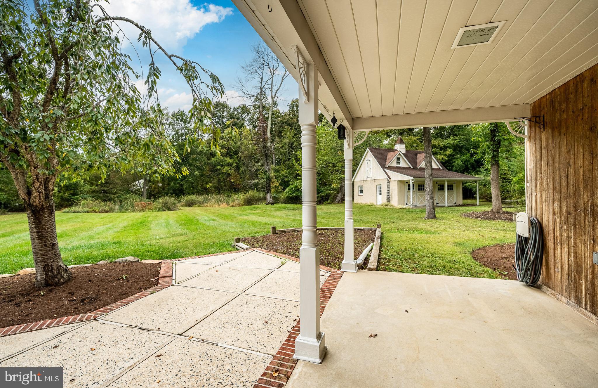 8 Andrews Road Malvern, PA 19355 - Photo 49 of 62 a view of a house with a big yard potted plants and large tree