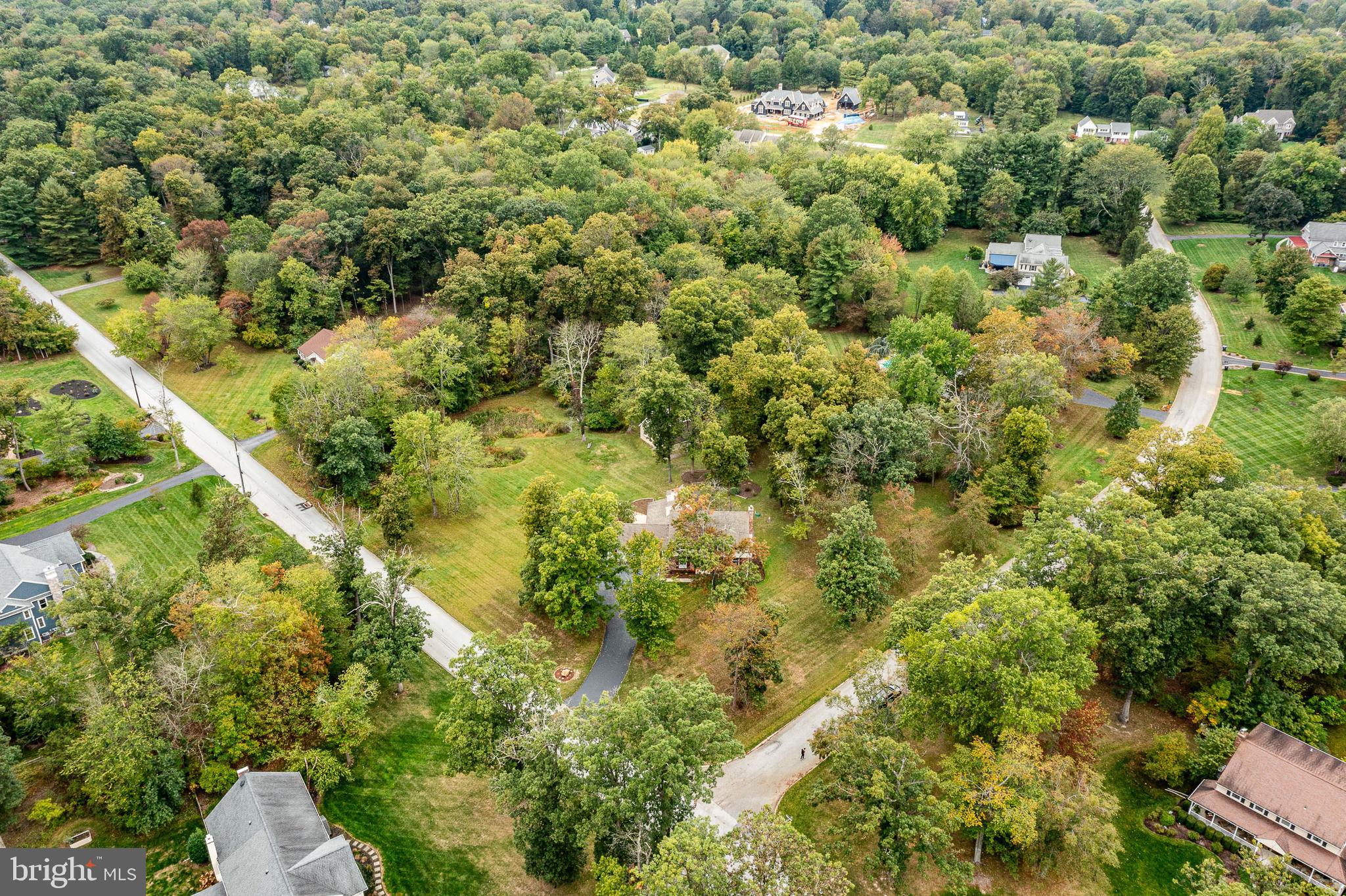 8 Andrews Road Malvern, PA 19355 - Photo 57 of 62 a view of a house with a lush green forest
