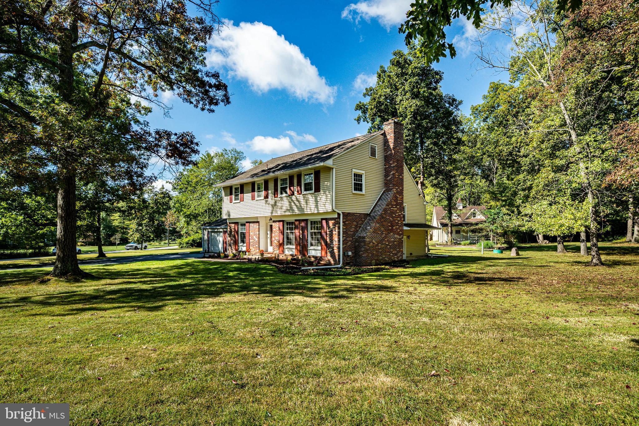 8 Andrews Road Malvern, PA 19355 - Photo 6 of 62 a view of a house with a big yard and large trees
