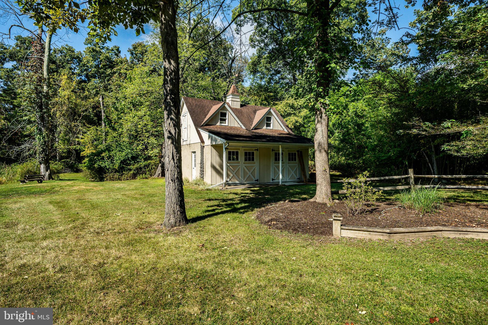 8 Andrews Road Malvern, PA 19355 - Photo 8 of 62 a front view of a house with garden