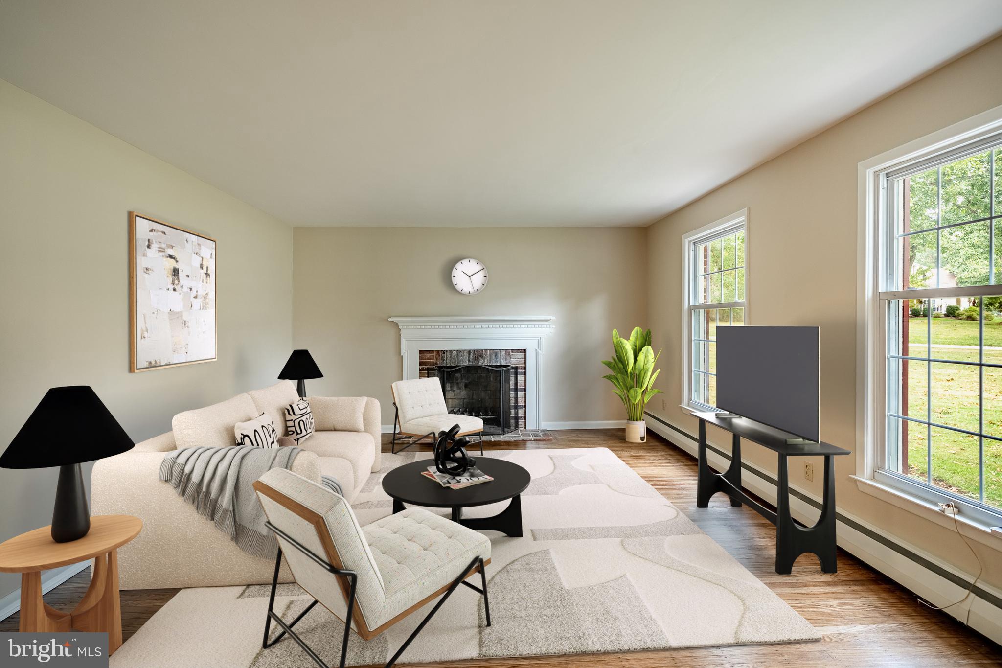 8 Andrews Road Malvern, PA 19355 - Photo 10 of 62 a living room with furniture and a flat screen tv with wooden floor