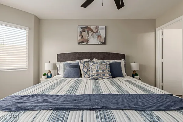 a kitchen with white cabinets and appliances