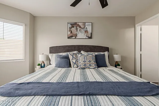 a kitchen with white cabinets and appliances