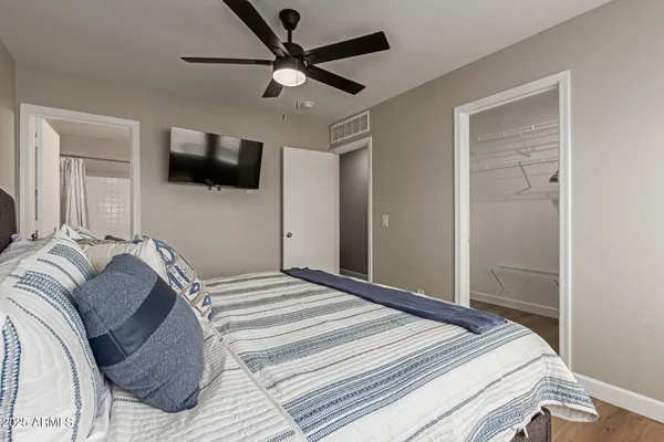 a bedroom with bed and a window