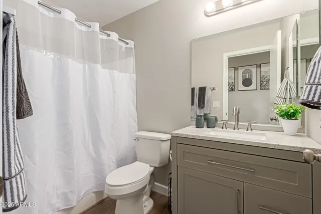 a bedroom with bed and window