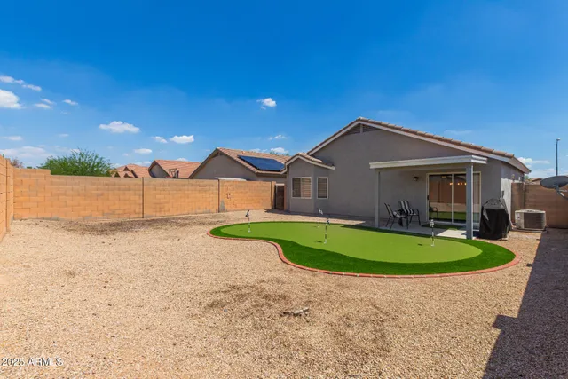 a view of a swimming pool with a yard