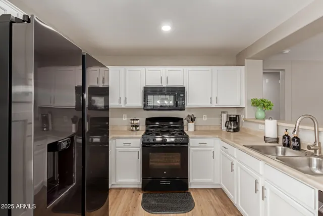 a kitchen with a dining table and chairs