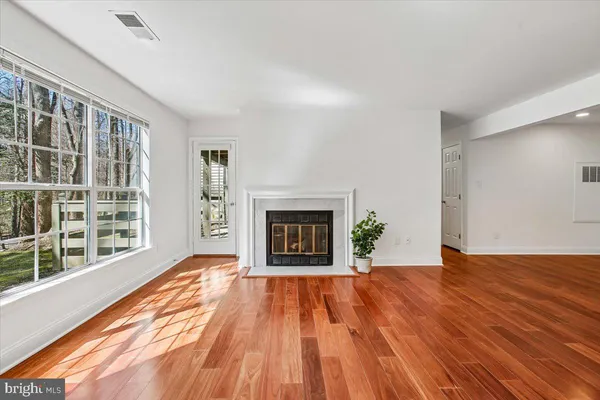 a bedroom with a bed and a fireplace