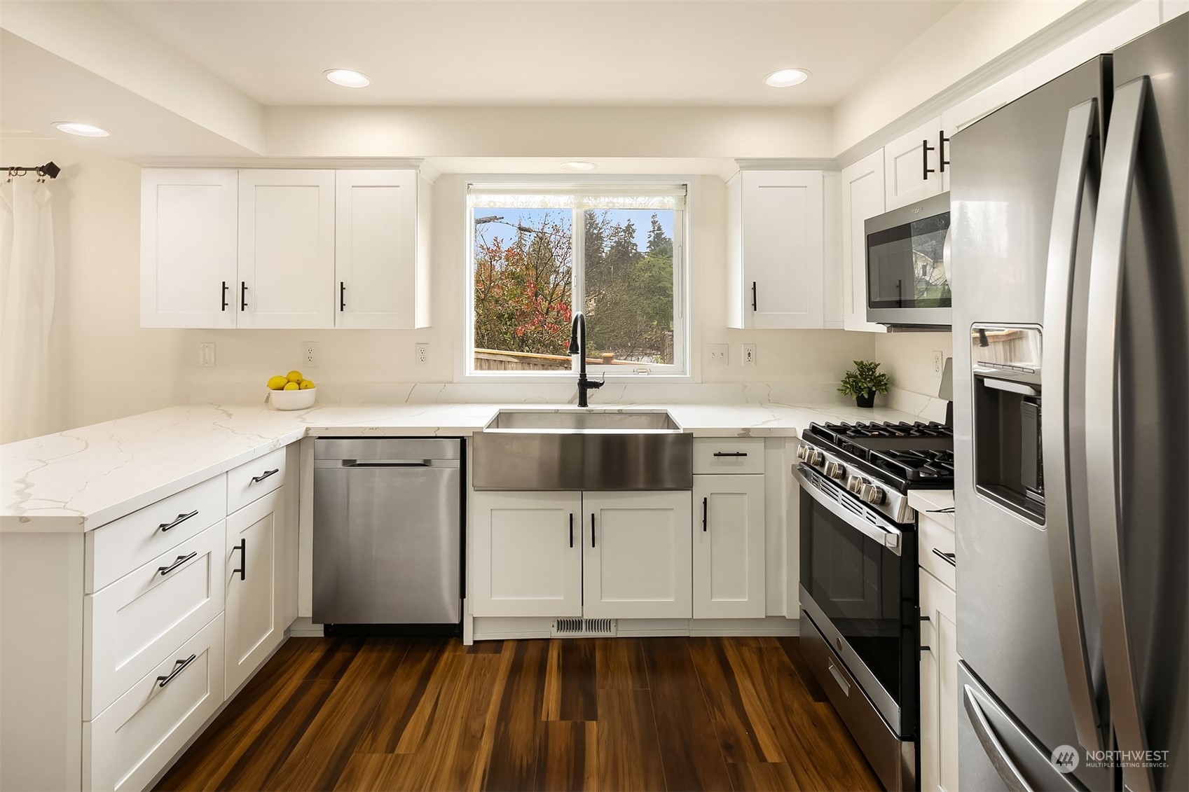 3410 189th Street Southeast Bothell, WA 98012 - Photo 11 of 23 a kitchen with a sink stove and refrigerator