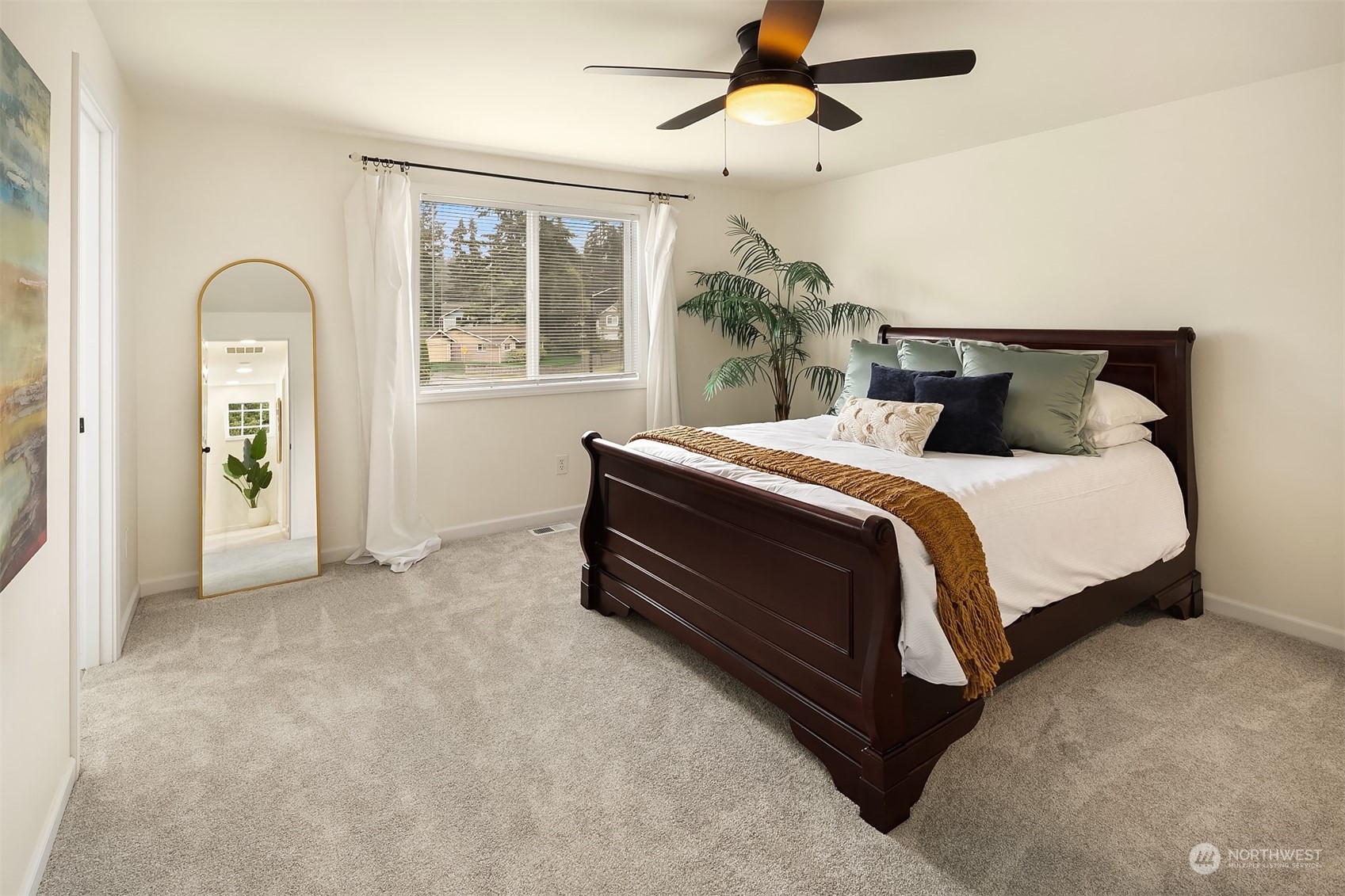 3410 189th Street Southeast Bothell, WA 98012 - Photo 12 of 23 a bedroom with a bed and a chandelier