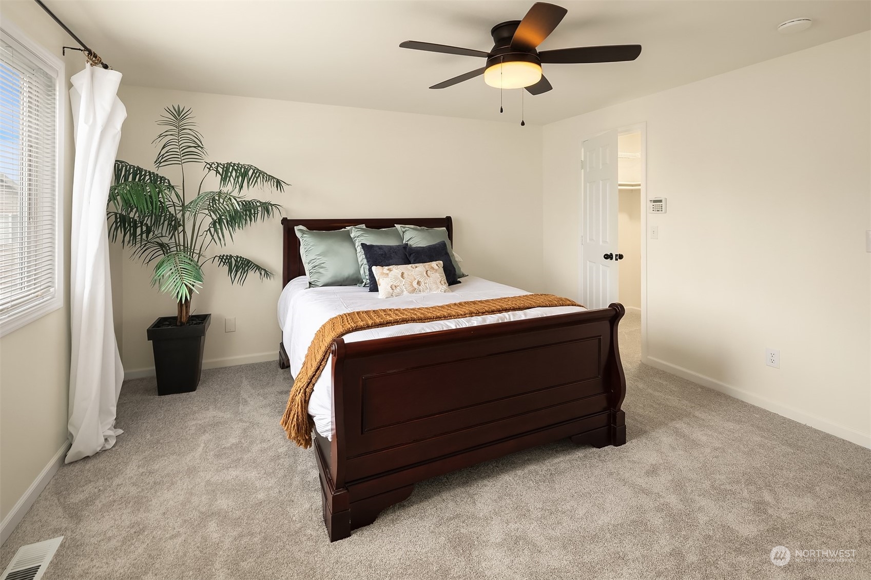 3410 189th Street Southeast Bothell, WA 98012 - Photo 13 of 23 a bedroom with a bed and a chandelier