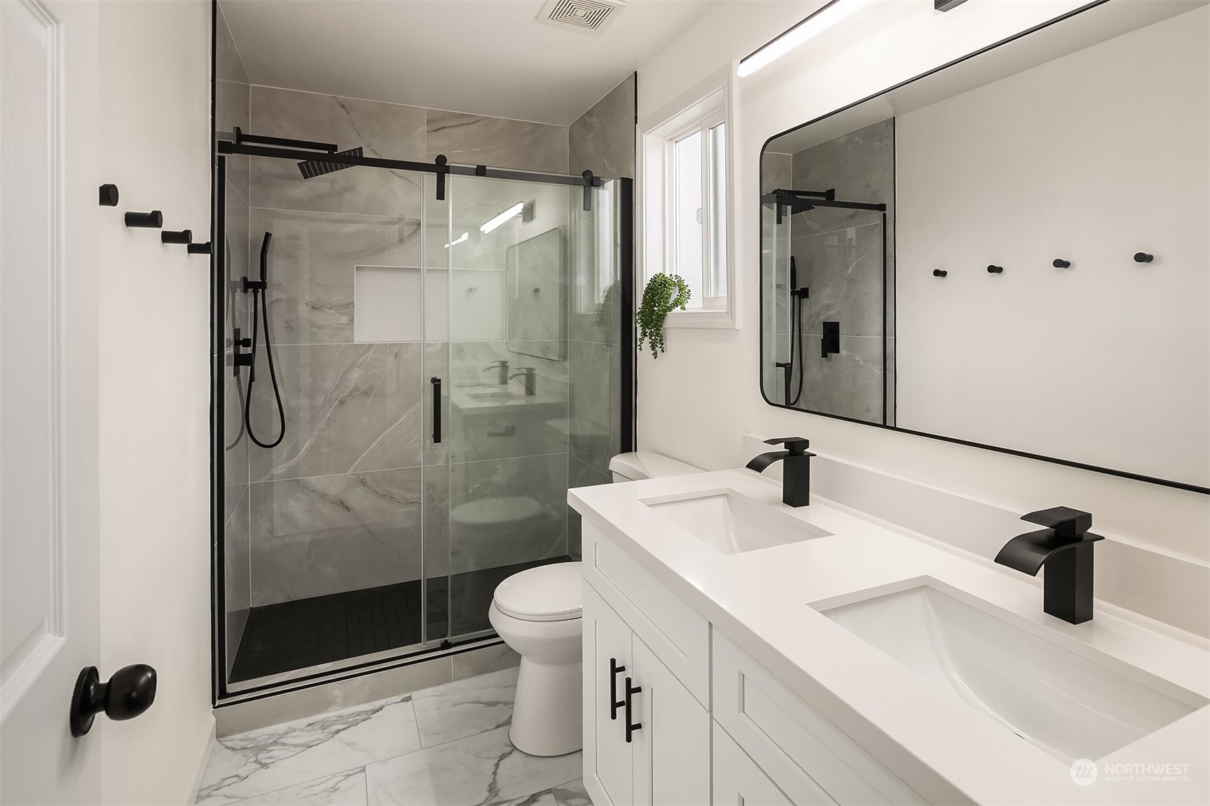 3410 189th Street Southeast Bothell, WA 98012 - Photo 14 of 23 a bathroom with a sink shower and a mirror