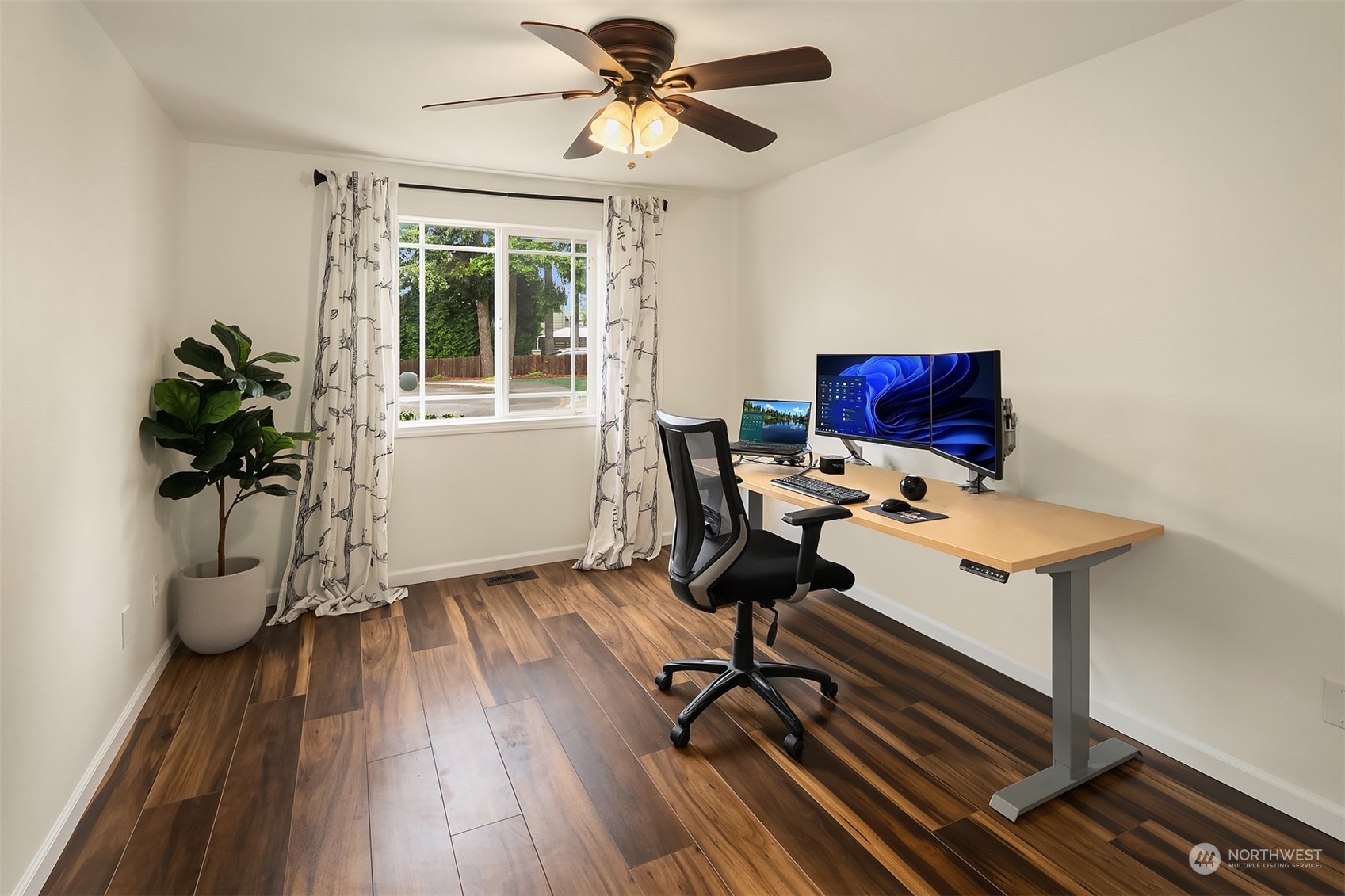 3410 189th Street Southeast Bothell, WA 98012 - Photo 18 of 23 a view of a workspace with furniture and a window