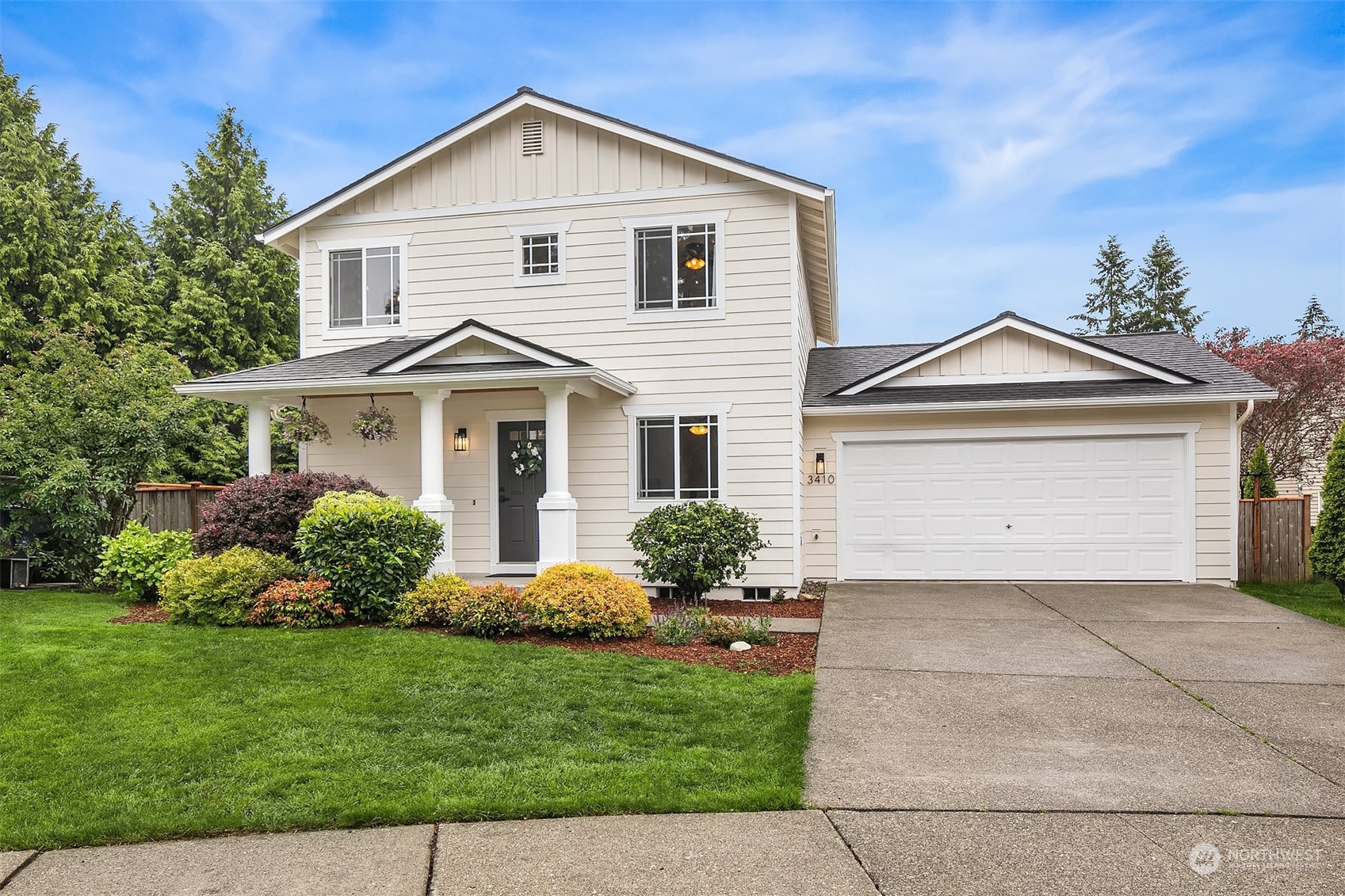 3410 189th Street Southeast Bothell, WA 98012 - Photo 2 of 23 a front view of a house with a yard and garage