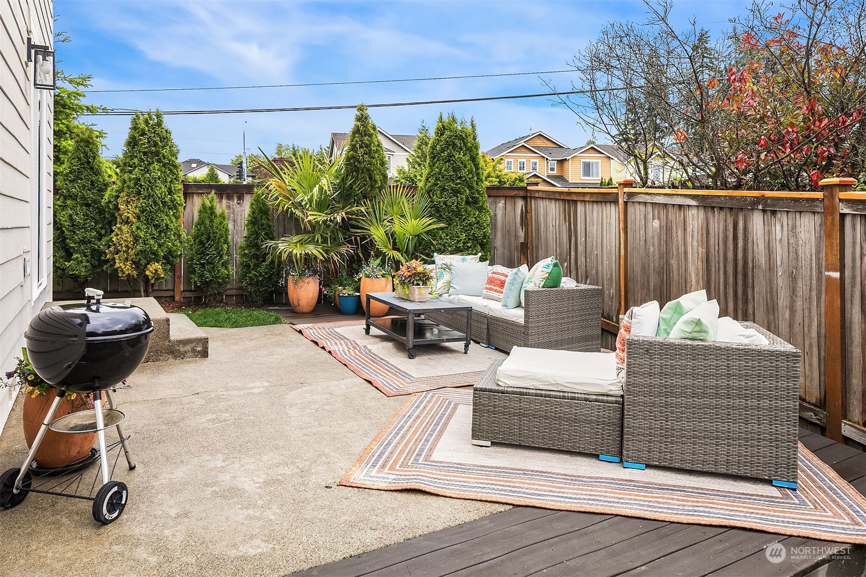 3410 189th Street Southeast Bothell, WA 98012 - Photo 22 of 23 a view of a patio with a table chairs and a potted plant